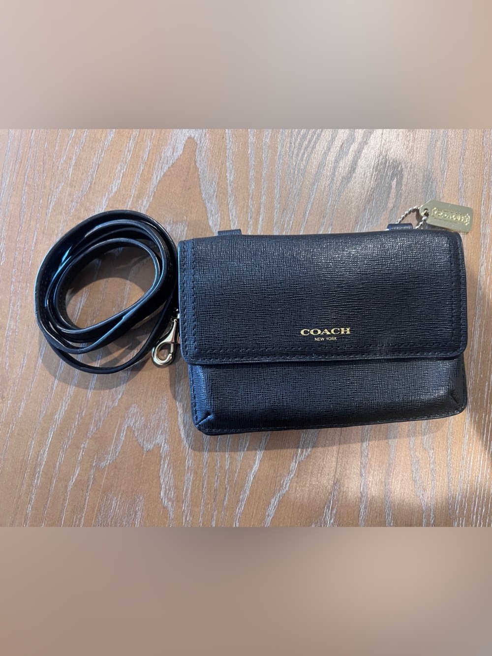 Coach Saffiano Phone Crossbody Wallet in classic black textured leather